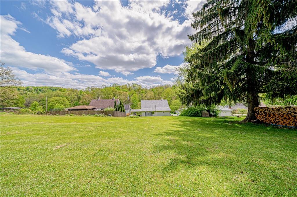 135 Elrico Road Slickville, PA 15684 - Photo 20 of 22 a view of a garden with a house