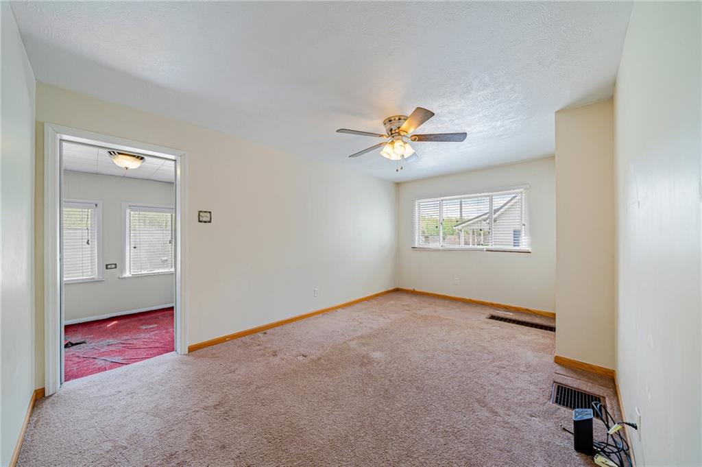 135 Elrico Road Slickville, PA 15684 - Photo 5 of 22 an empty room with windows and closet