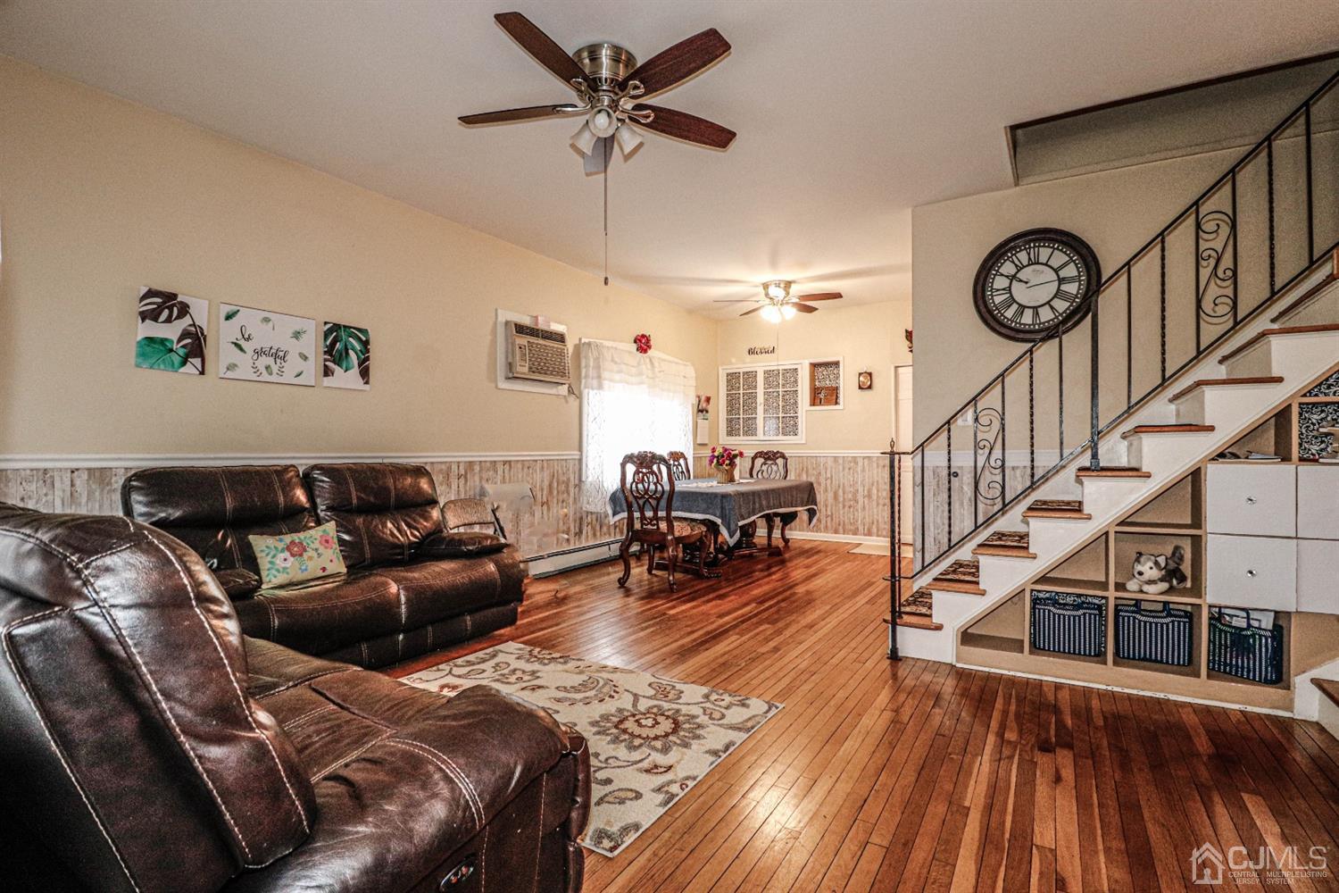 6 Brandywine Road Fords, NJ 08863 - Photo 6 of 38 a living room with furniture a clock tv and a ceiling fan