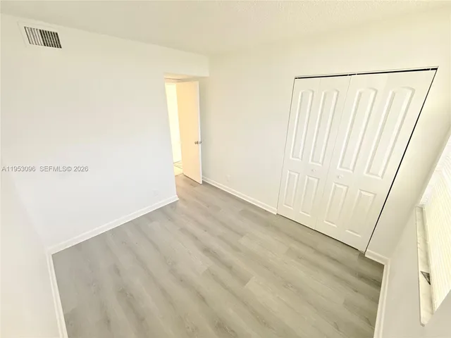 a bathroom with a sink toilet and mirror