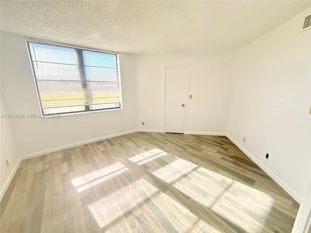 a bathroom with a vanity and a shower