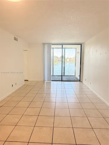 a view of a livingroom with a large window