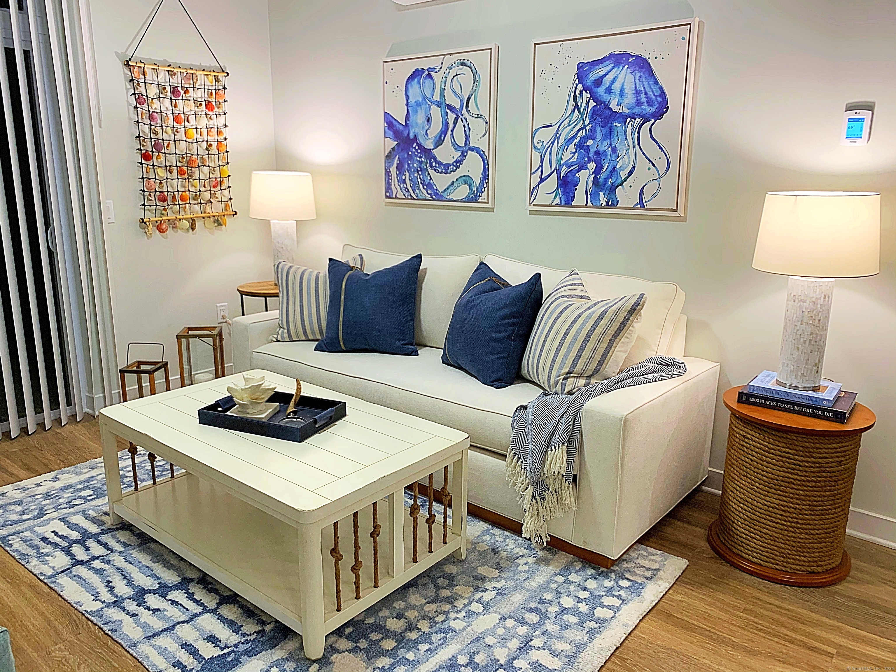 50 Perkins Farm Drive, Unit PH402 NEWPORT Stonington, CT 06355 - Photo 16 of 31 a bedroom with a bed and wooden floor