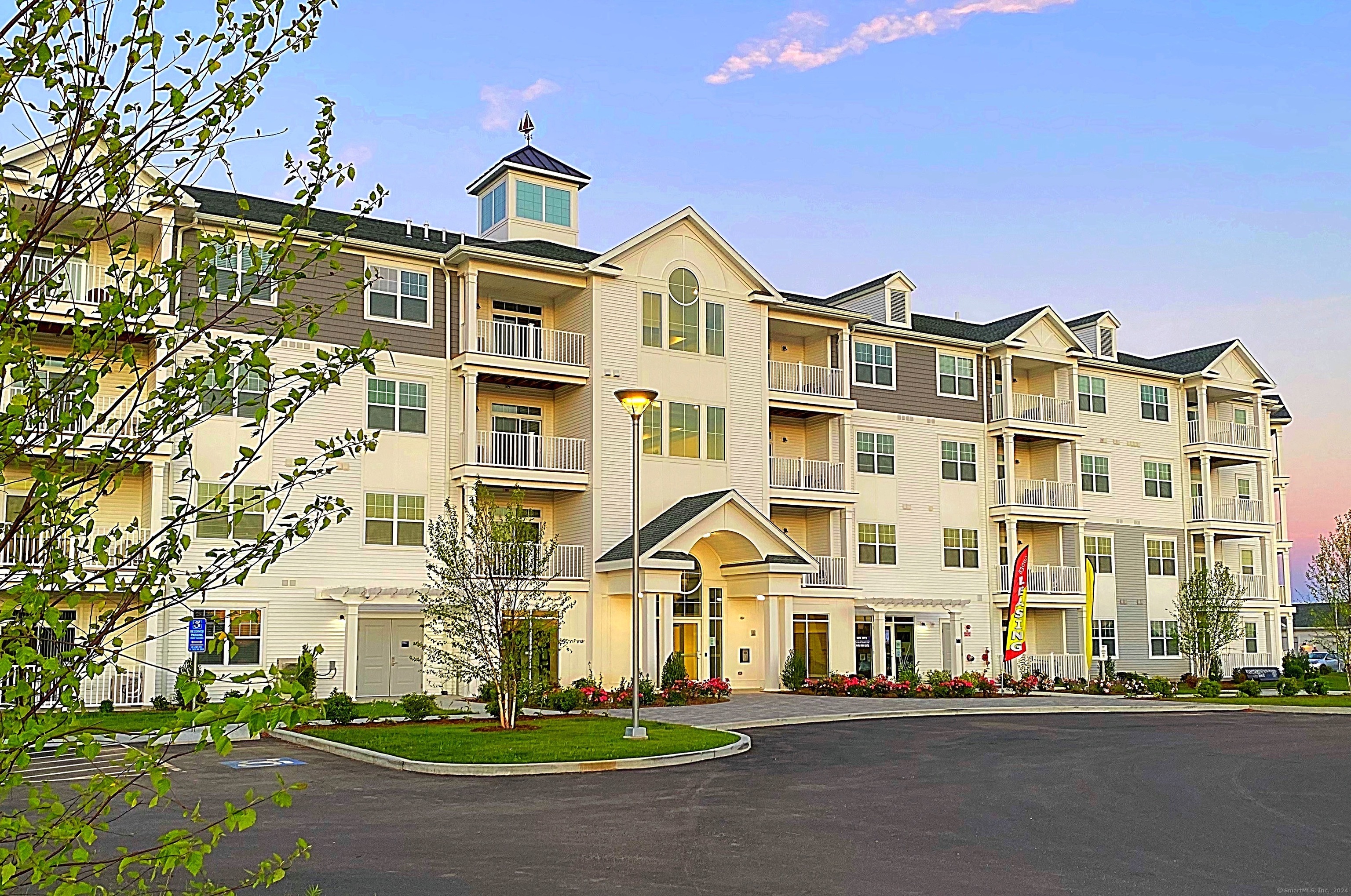 50 Perkins Farm Drive, Unit PH402 NEWPORT Stonington, CT 06355 - Photo 3 of 31 a front view of a building with street view