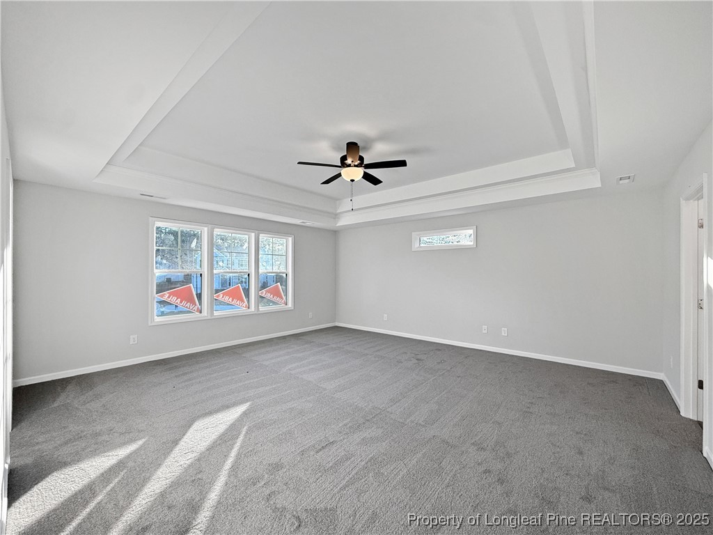 342 Flying Bolt Drive Raeford, NC 28376 - Photo 15 of 30 an empty room with ceiling fan and windows