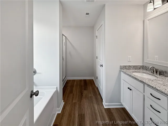 a bathroom with a sink and a granite counter tops