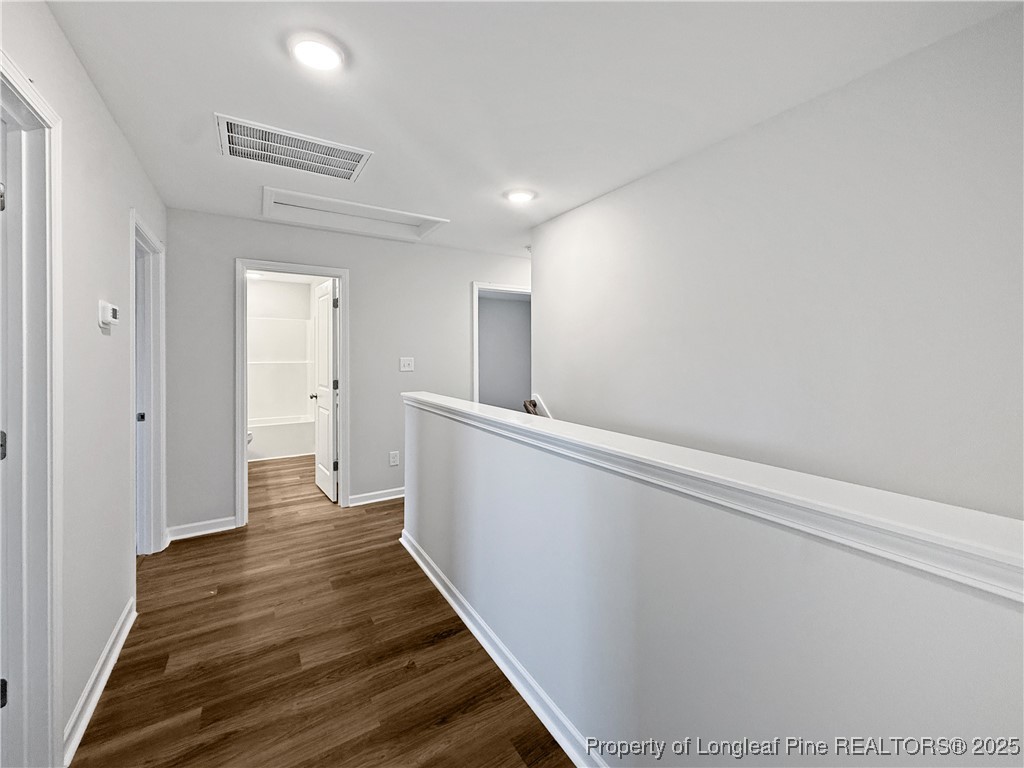 342 Flying Bolt Drive Raeford, NC 28376 - Photo 24 of 30 a view of a hallway with wooden floor