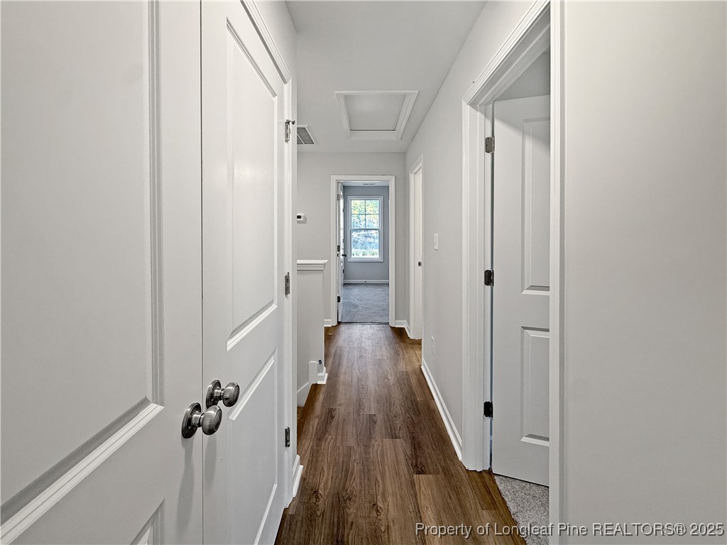 342 Flying Bolt Drive Raeford, NC 28376 - Photo 26 of 30 a view of a hallway with wooden floor and staircase