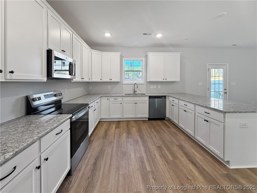 342 Flying Bolt Drive Raeford, NC 28376 - Photo 7 of 30 a large kitchen with cabinets
