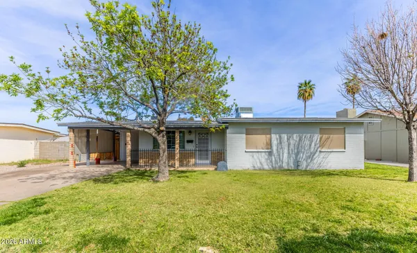 a view of a house with pool and chairs