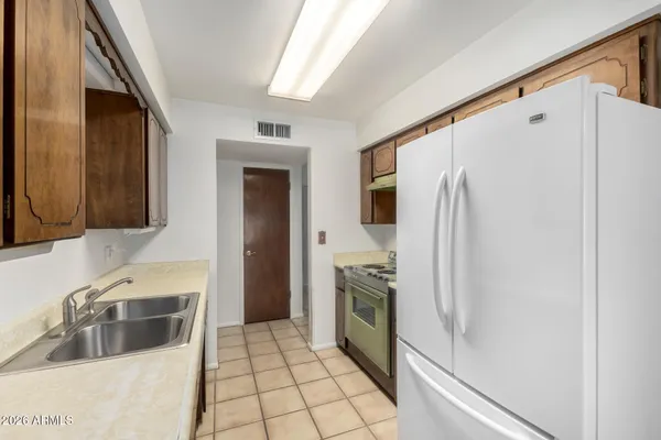 a kitchen with stainless steel appliances granite countertop a stove and a sink