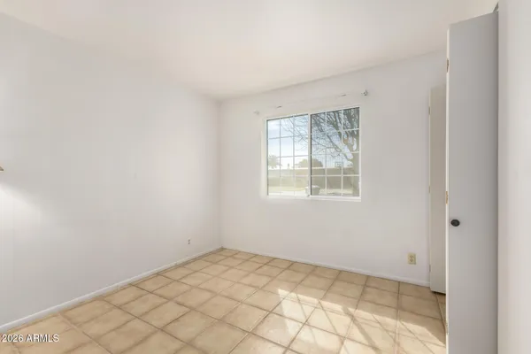 a view of an empty room and window