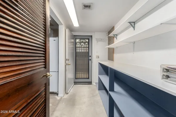 a view of entryway with wooden floor and a yard