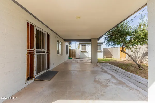 a room with a table and a wall painting