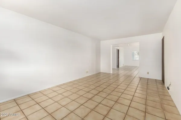 a view of an empty room and window