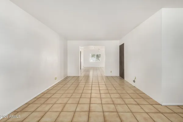 a view of an empty room and window