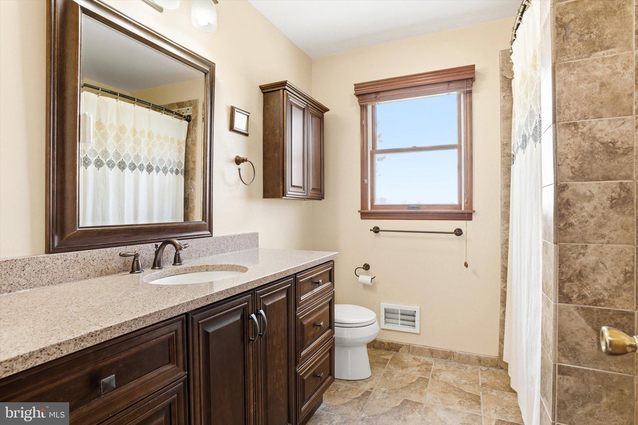 25446 Mt Pleasant Road Columbus, NJ 08022 - Photo 18 of 32 a bathroom with a granite countertop sink toilet and shower