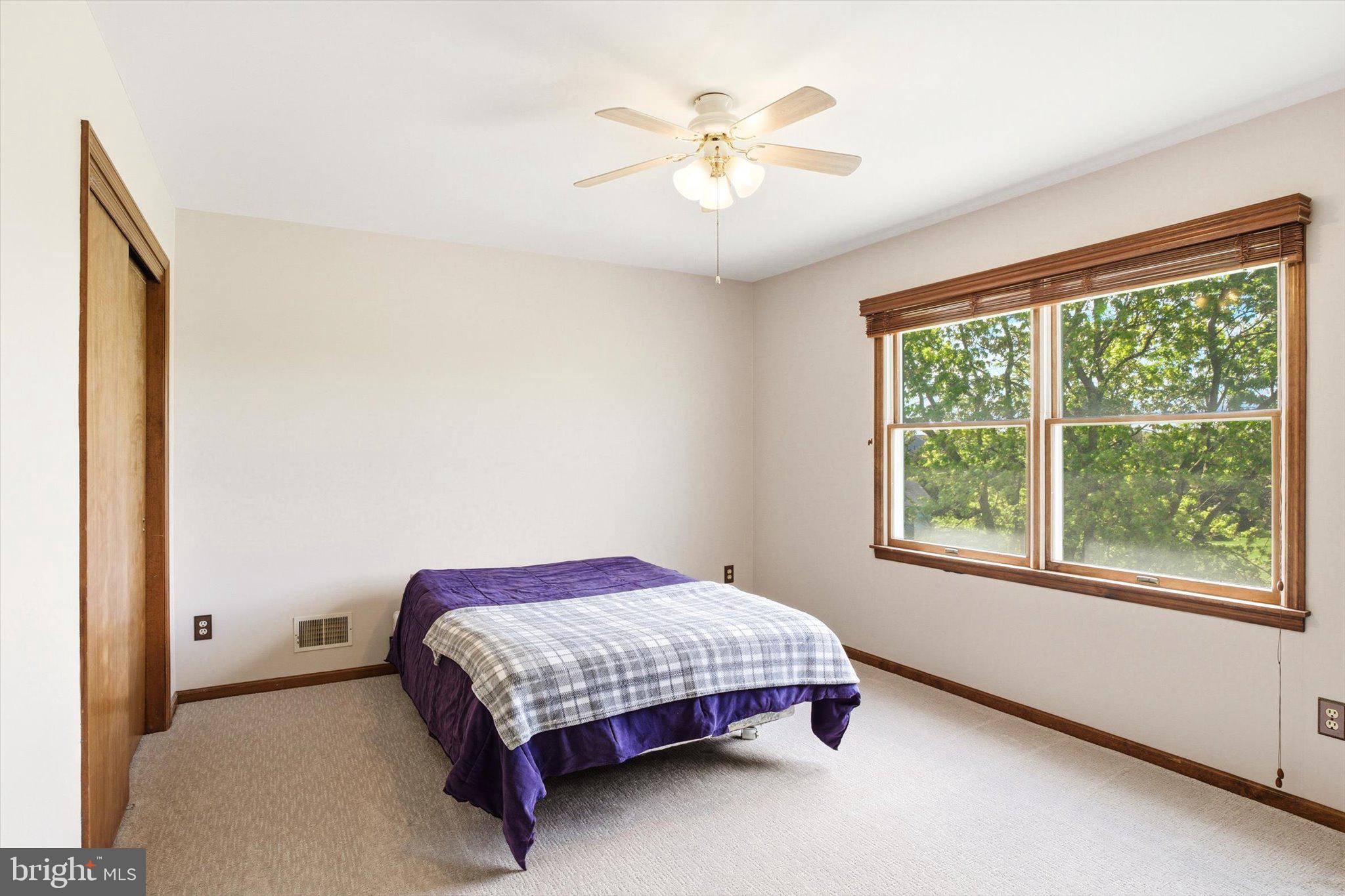 25446 Mt Pleasant Road Columbus, NJ 08022 - Photo 20 of 32 a bedroom with a bed and a window