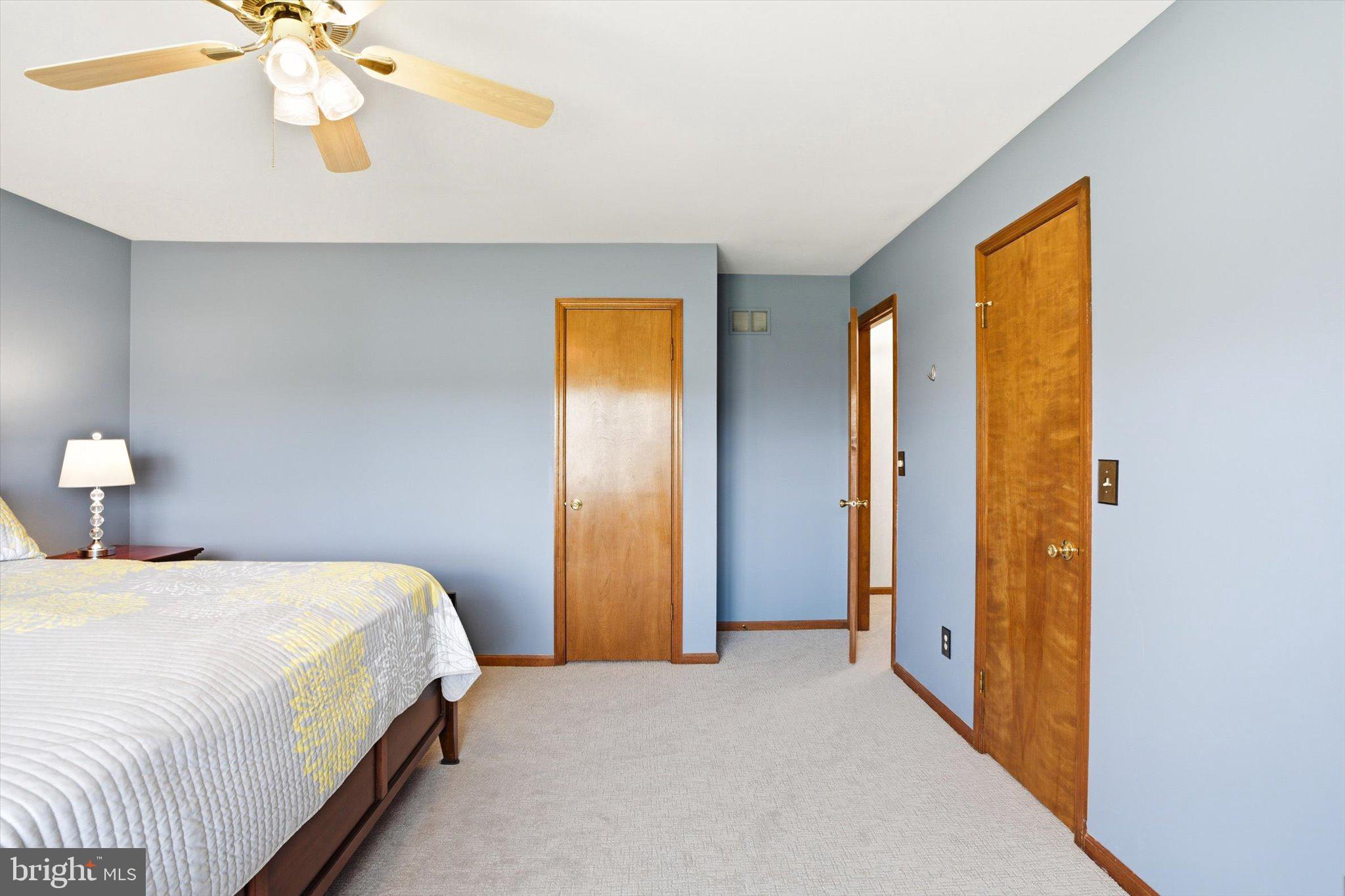 25446 Mt Pleasant Road Columbus, NJ 08022 - Photo 22 of 32 a bedroom with a bed and a chandelier