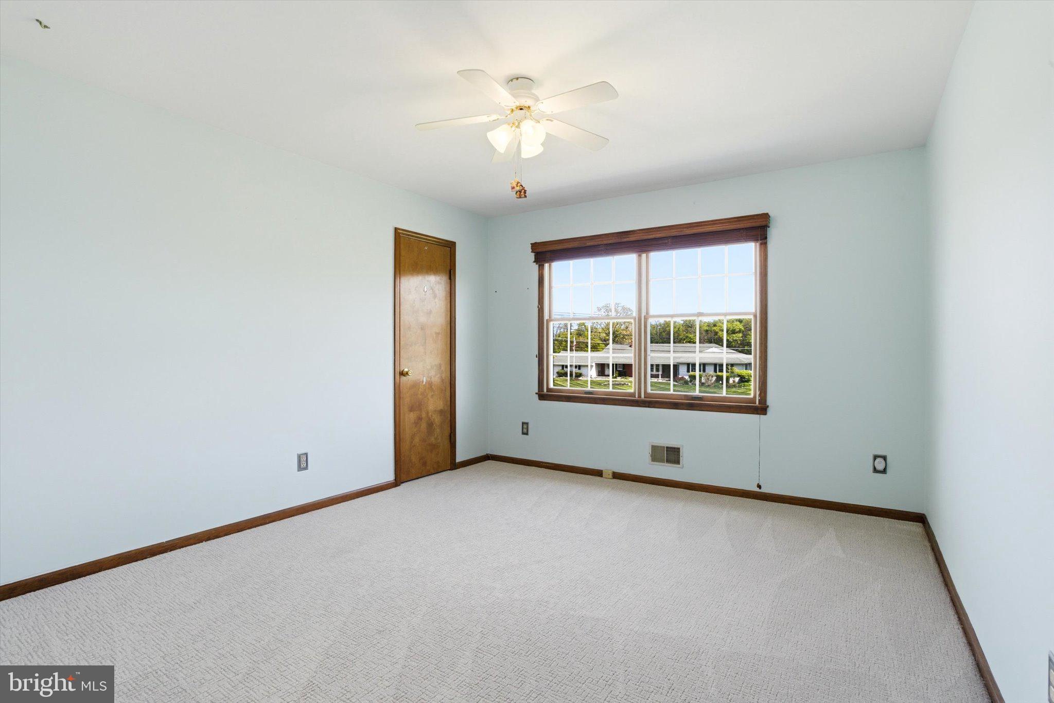 25446 Mt Pleasant Road Columbus, NJ 08022 - Photo 24 of 32 an empty room with windows and chandelier fan