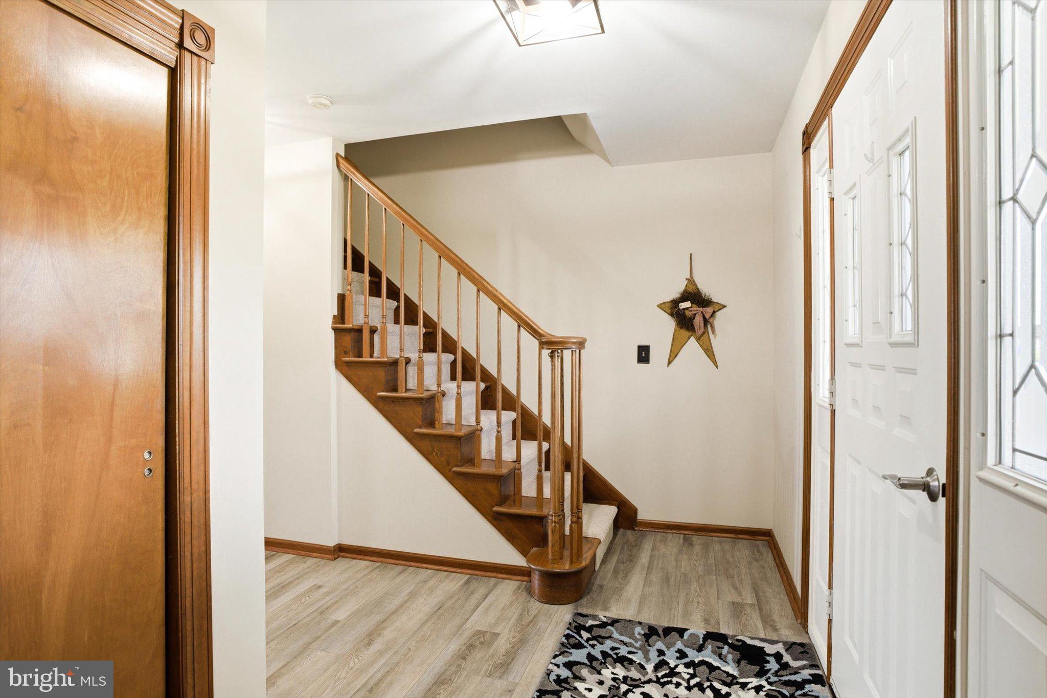 25446 Mt Pleasant Road Columbus, NJ 08022 - Photo 5 of 32 a view of a hallway with wooden floor and staircase