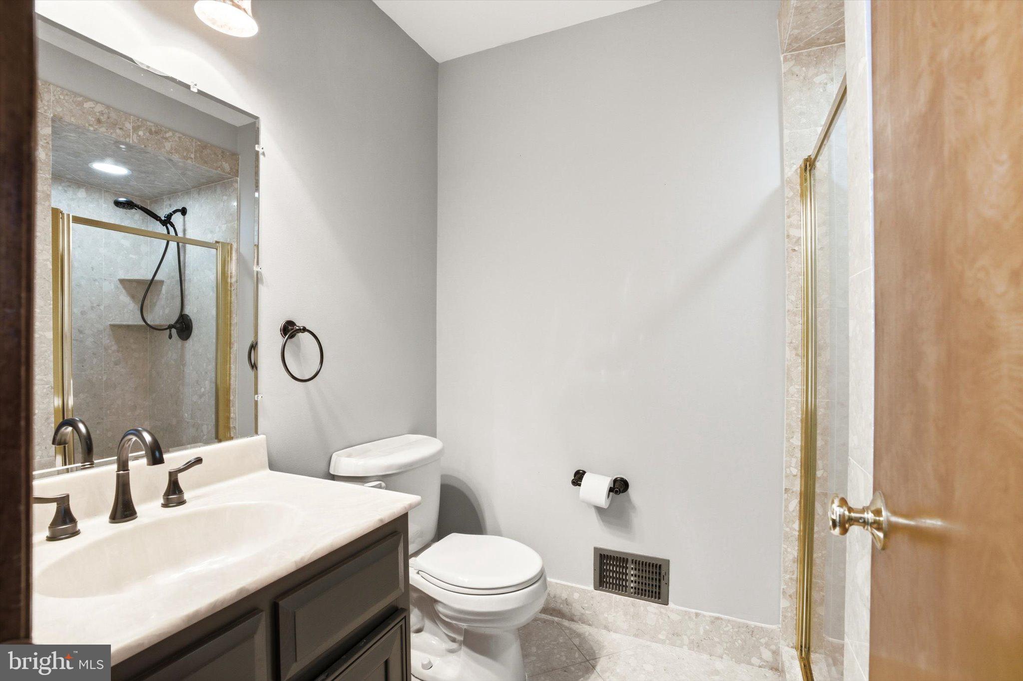 25446 Mt Pleasant Road Columbus, NJ 08022 - Photo 9 of 32 a bathroom with a sink toilet and shower