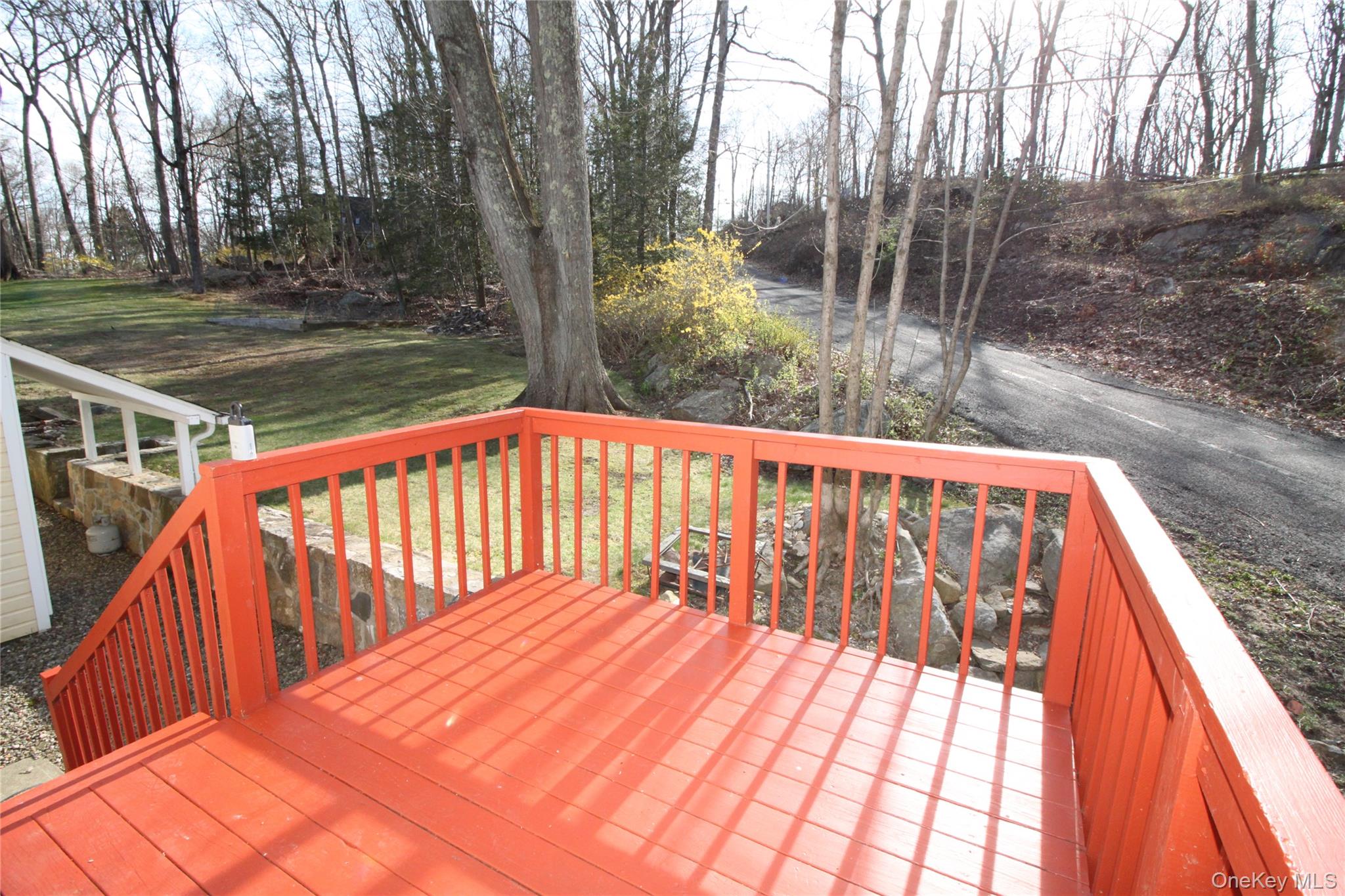 495 Farmers Mills Road Carmel, NY 10512 - Photo 14 of 24 Wooden deck featuring a lawn