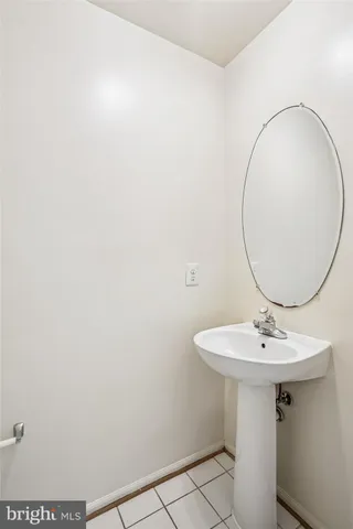 a bathroom with a sink and mirror