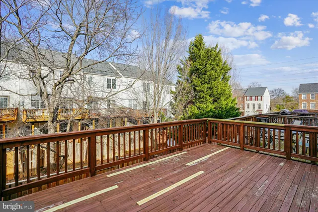 a view of a balcony with wooden floor