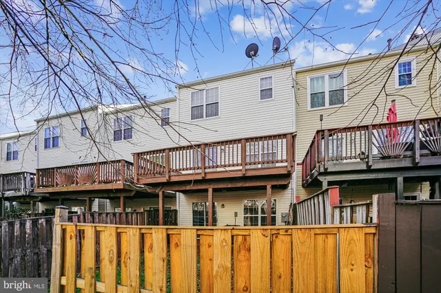 a view of a brick house with large windows