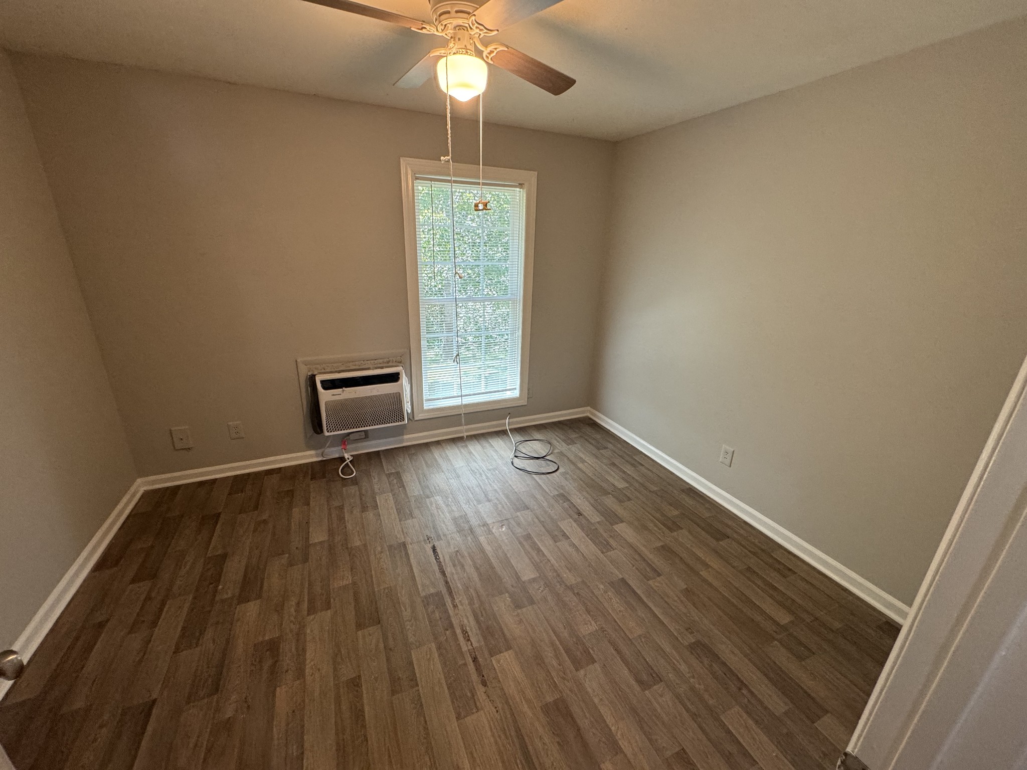 1321 Dudley Street, Unit 11 Murfreesboro, TN 37130 - Photo 4 of 4 wooden floor in an empty room with a window