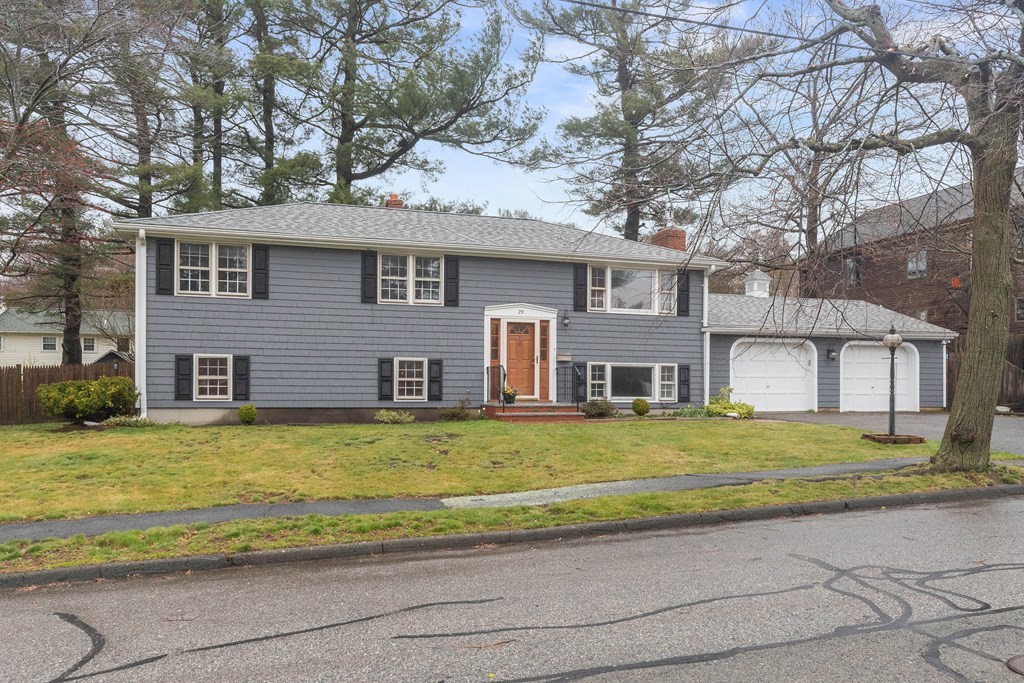 29 Taft Avenue Beverly, MA 01915 - Photo 1 of 41 a front view of a house with a garden