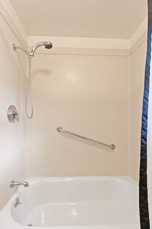 29 Taft Avenue Beverly, MA 01915 - Photo 18 of 41 a bathroom with a bath tub with a shower