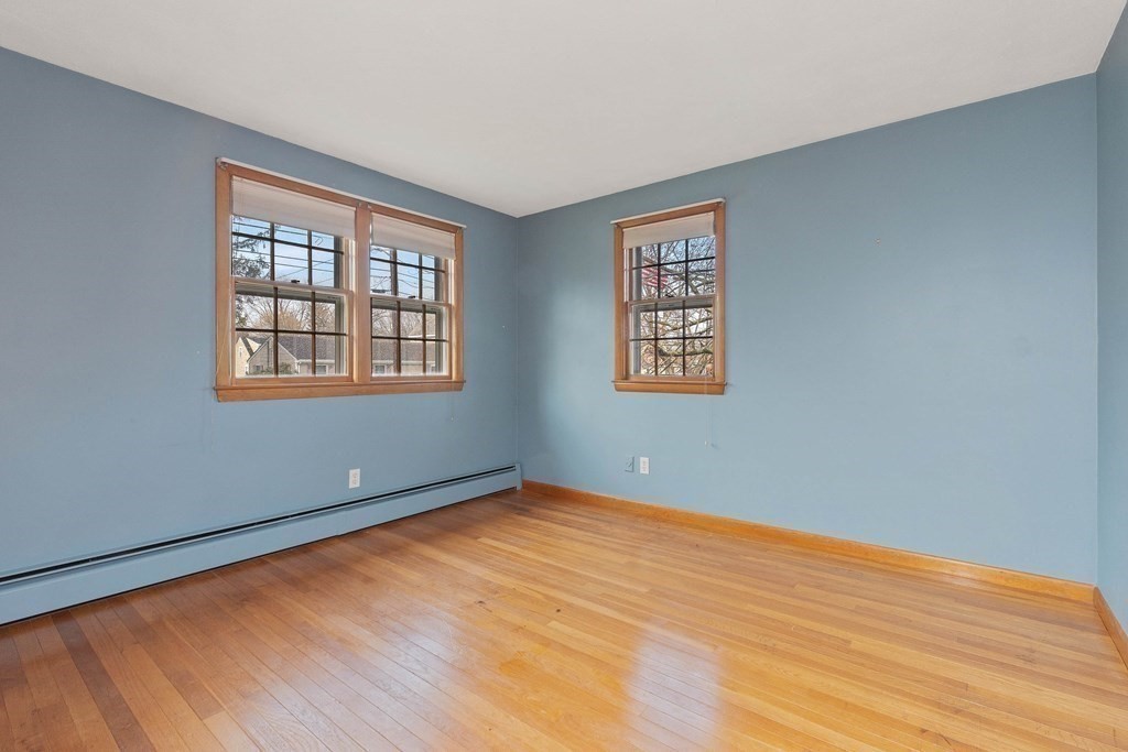 29 Taft Avenue Beverly, MA 01915 - Photo 19 of 41 a view of an empty room with wooden floor and a window