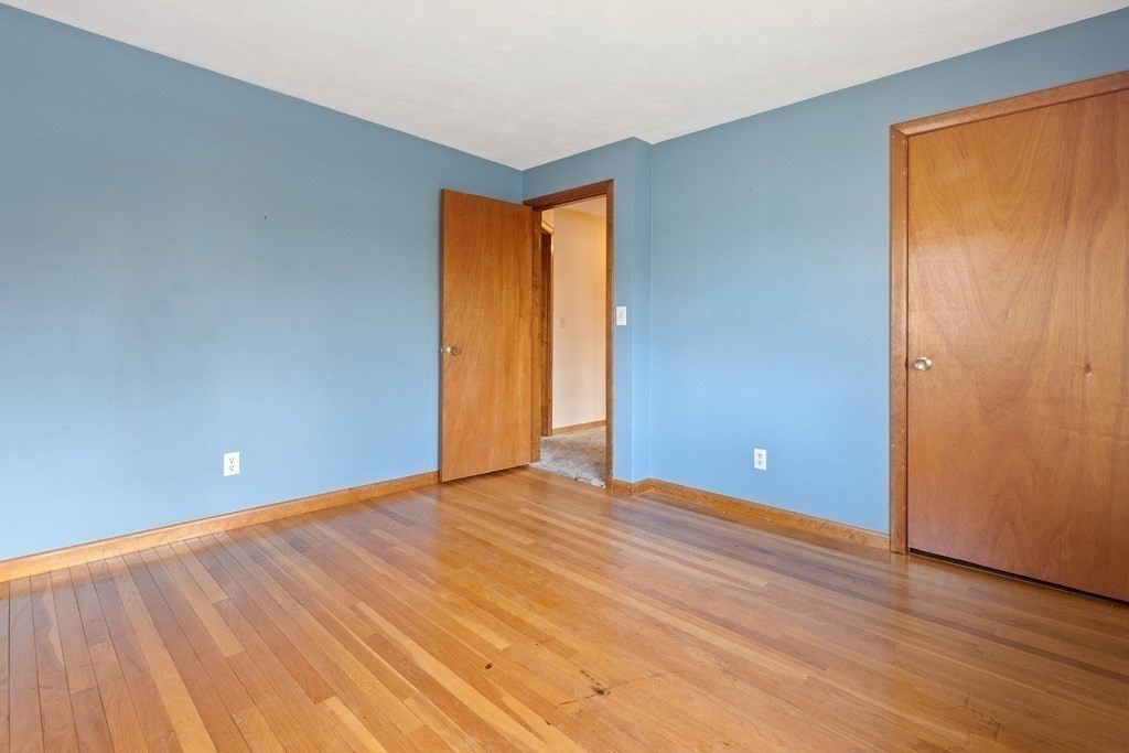 29 Taft Avenue Beverly, MA 01915 - Photo 20 of 41 a view of an empty room with wooden floor and a window