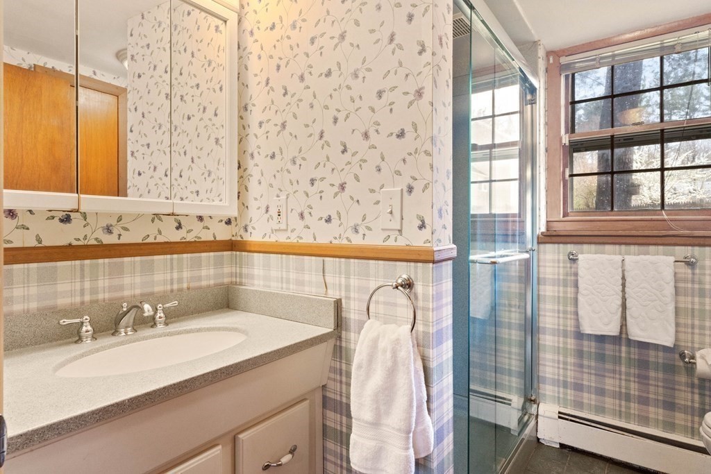 29 Taft Avenue Beverly, MA 01915 - Photo 26 of 41 a bathroom with a sink and a mirror