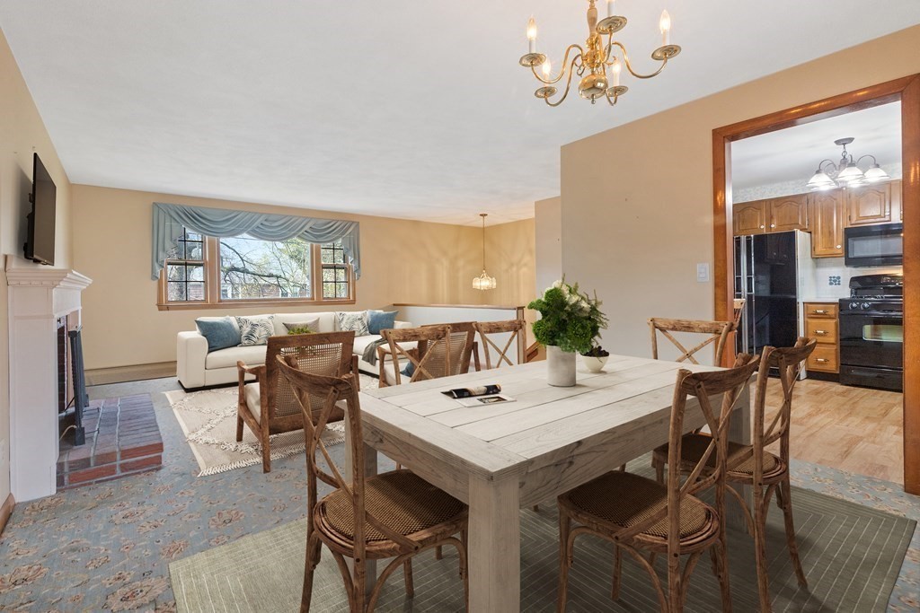 29 Taft Avenue Beverly, MA 01915 - Photo 8 of 41 a view of a dining room with furniture and a large window