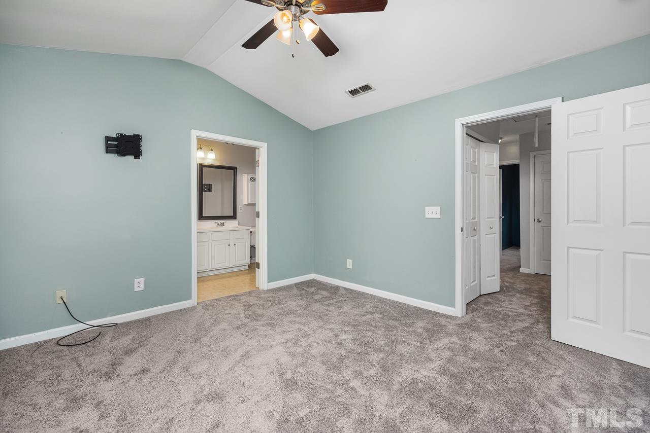 4422 Vienna Crest Drive Raleigh, NC 27613 - Photo 14 of 28 a view of an empty room with a ceiling fan
