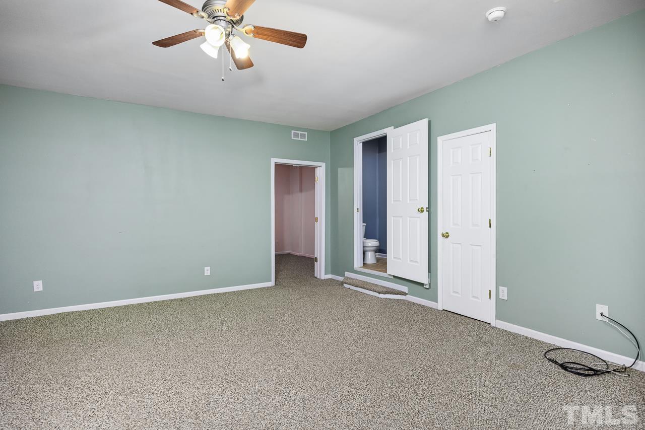 4422 Vienna Crest Drive Raleigh, NC 27613 - Photo 21 of 28 a view of an empty room with a window