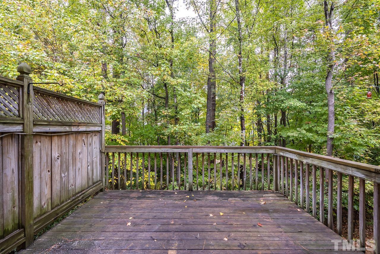 4422 Vienna Crest Drive Raleigh, NC 27613 - Photo 25 of 28 a view of a balcony with wooden floor and fence