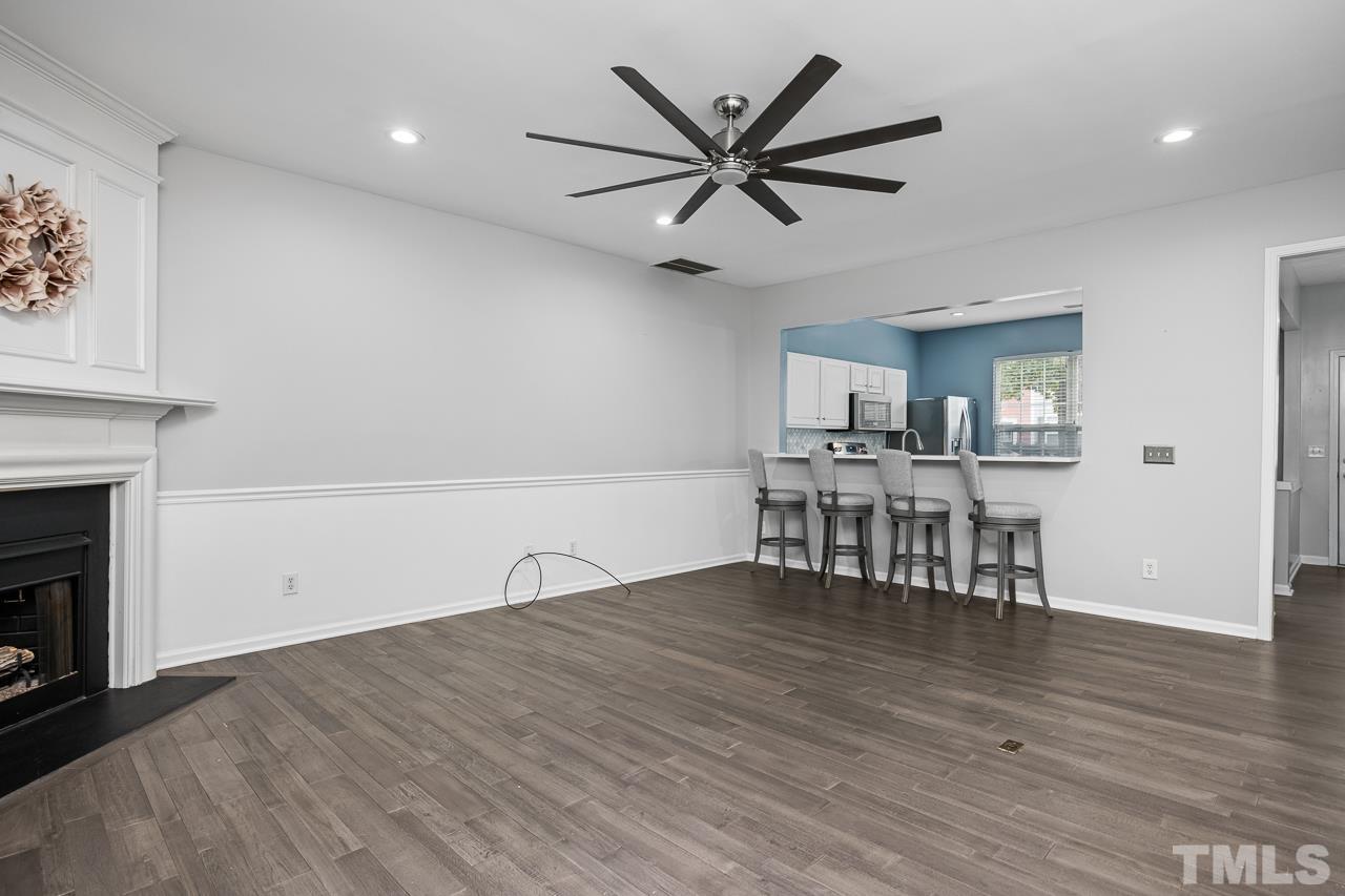 4422 Vienna Crest Drive Raleigh, NC 27613 - Photo 8 of 28 a view of a livingroom with furniture and a ceiling fan