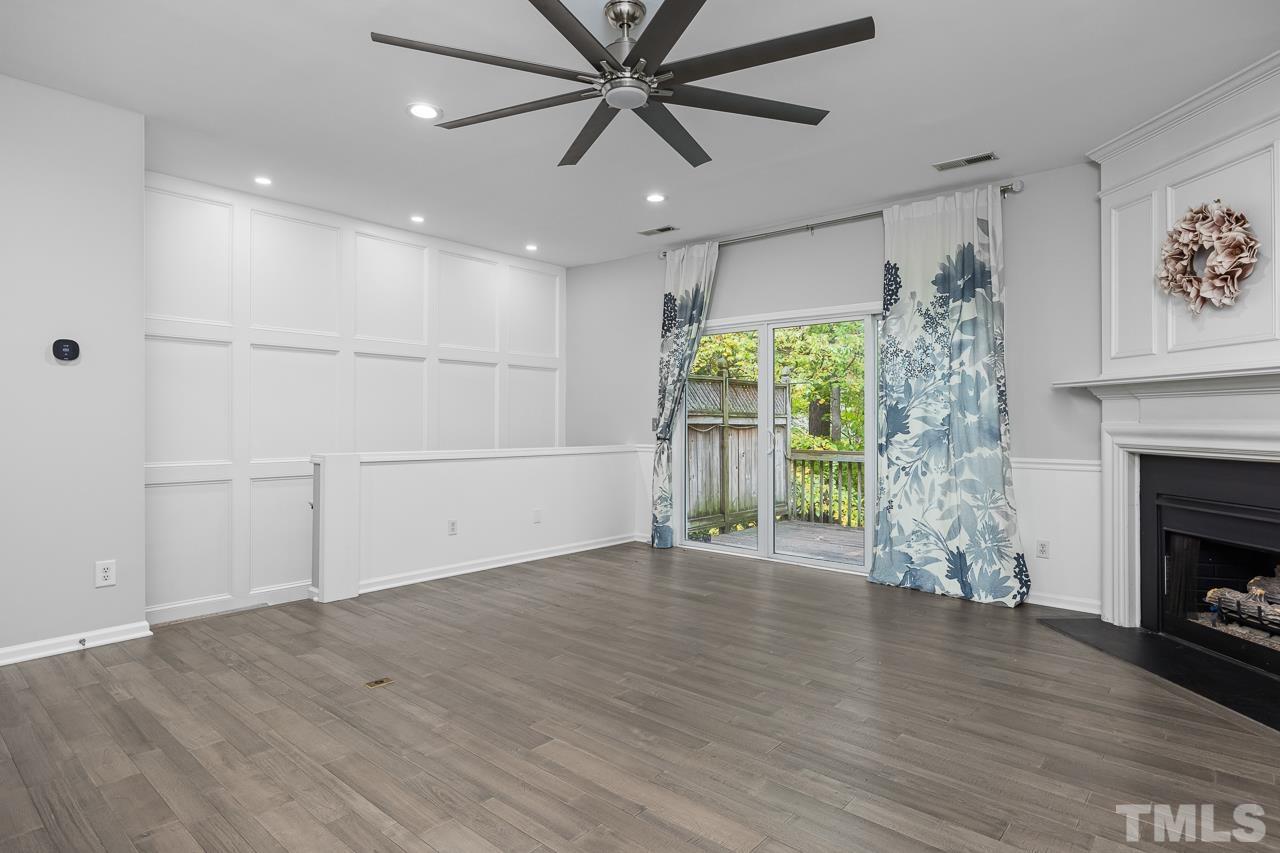 4422 Vienna Crest Drive Raleigh, NC 27613 - Photo 10 of 28 a view of empty room with wooden floor and fan