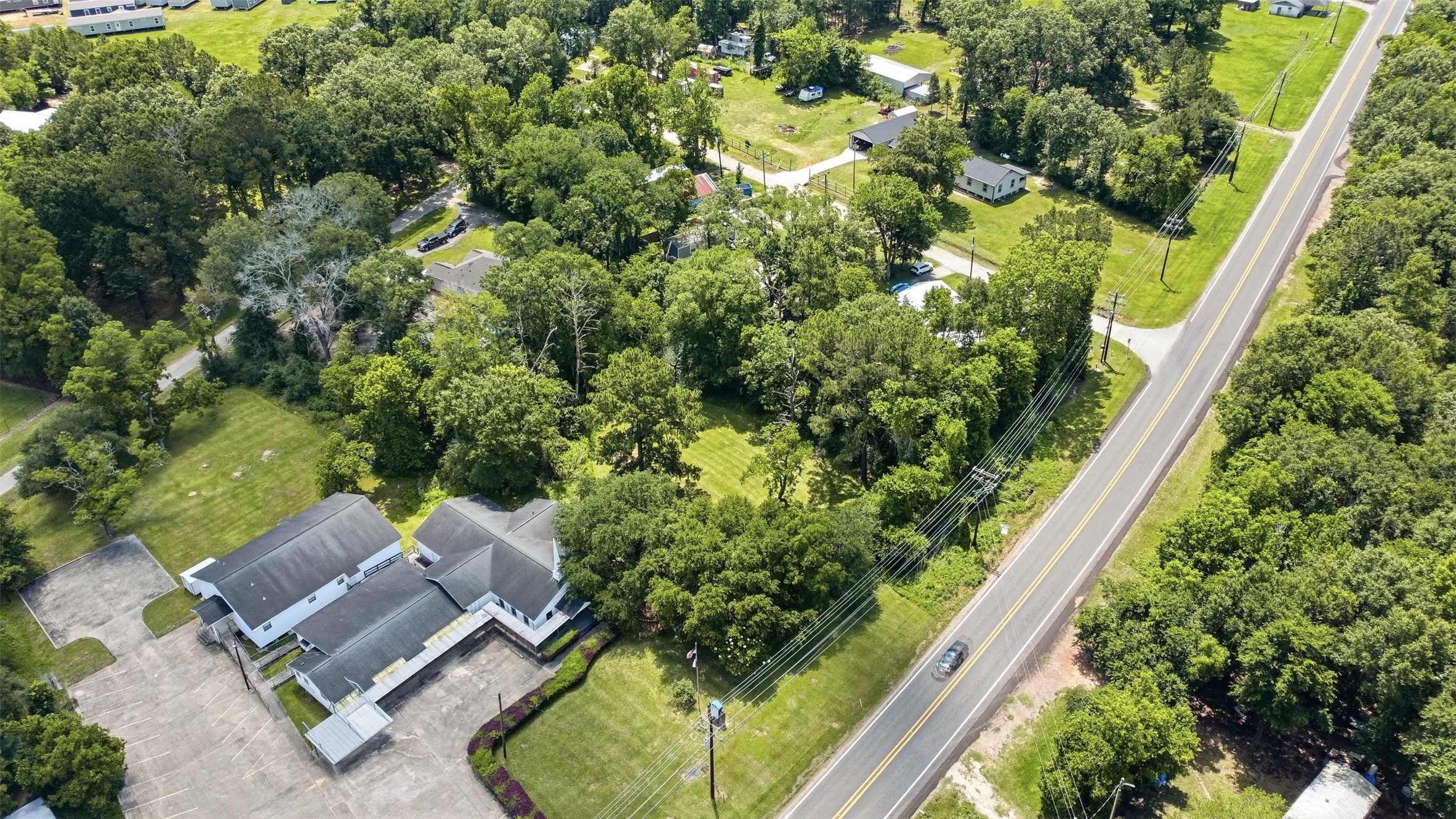 0 State Highway Loop Goodrich, TX 77335 - Photo 19 of 22 an aerial view of a house with a garden