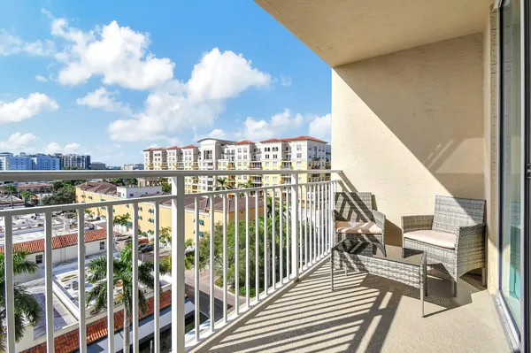 a view of a balcony with city view