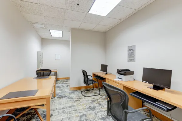 a workspace with furniture and lamp