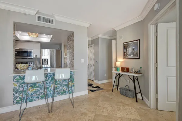 a view of a livingroom with furniture and windows
