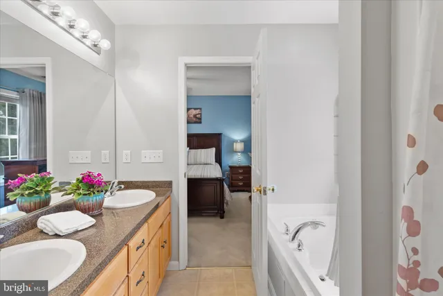 a bath room with a sink and a bath tub