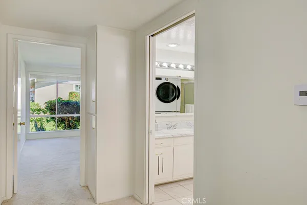 a bathroom with a sink mirror and vanity