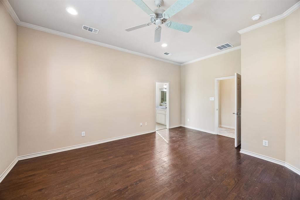 676 Scenic Ranch Circle Fairview, TX 75069 - Photo 13 of 30 an empty room with wooden floor and ceiling fan