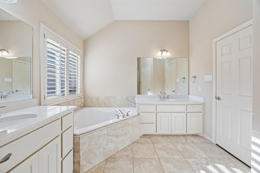 676 Scenic Ranch Circle Fairview, TX 75069 - Photo 16 of 30 a spacious bathroom with a tub sink and mirror